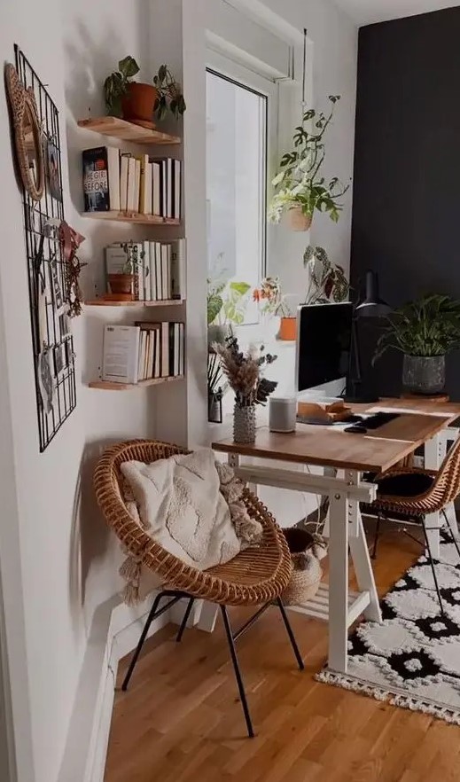 a modern country home office with a trestle desk, rattan chairs, floating shelves, a memo grd and some cool potted plants