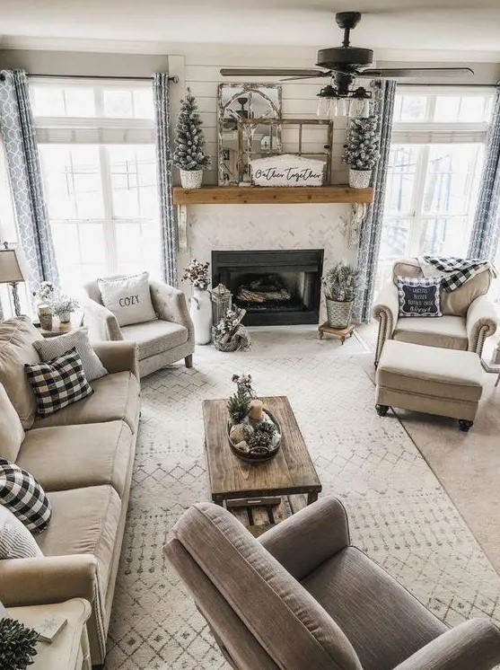 a modern country living room with a fireplace, elegant neutral furniture, printed textiles and a low coffee table is amazing