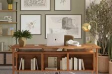 a modern farmhouse home office with a light green accent wall, open shelving, a stained desk, layered rugs, potted plants