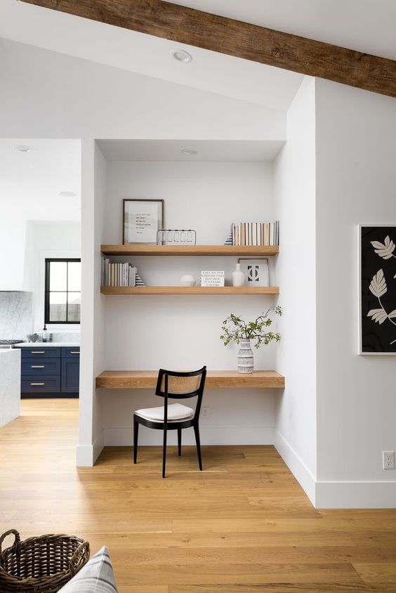 A niche with built in shelves and a desk, some books and decor and a comfortable chair is a lovely idea for a modern home