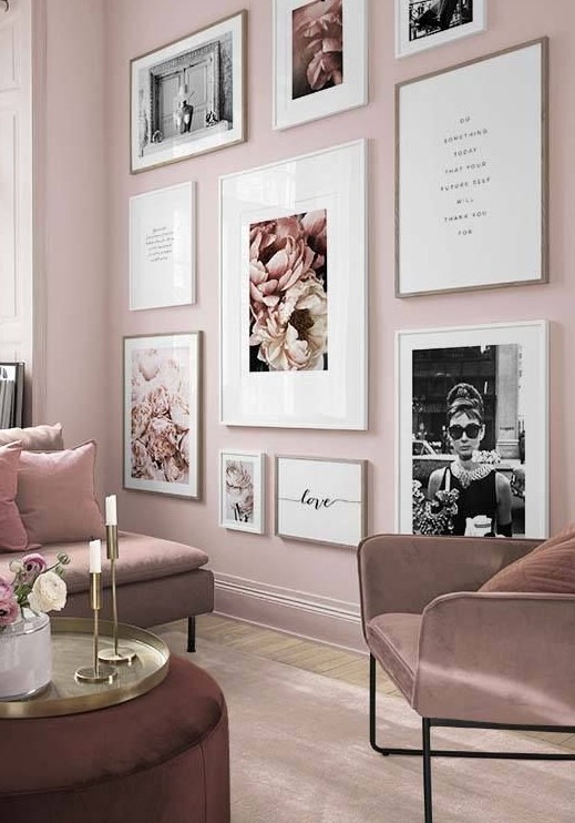 a romantic light pink living room with mauve furniture, a gorgeous glam gallery wall and touches of gold