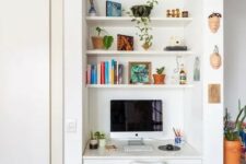 a tiny nook with built-in shelves and a desk with a drawer, a white chair, books and potted plants is a cool space fo working