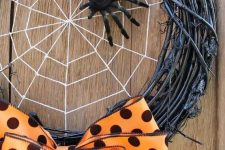 06 a bold Halloween wreath of black vine, a spider web and a black spider plus an orange polka dot bow for an accent