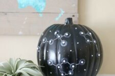 06 a catchy black Halloween pumpkin with white star spots and 3D constellations is a lovely idea and requires no carving