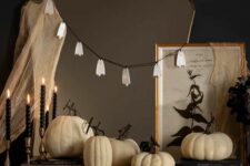 10 simple Halloween mirror decor with some cheesecloth and a ghost garland is a cool and fast to realize idea