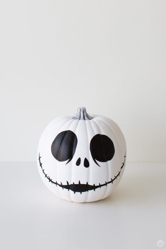 a classic Jack Skellington pumpkin in black and white is easy to make with paint and maybe a sharpie