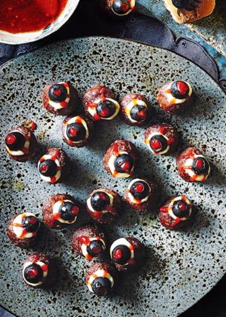 meatball eyeballs with olives and cheese are a cool food idea for Halloween