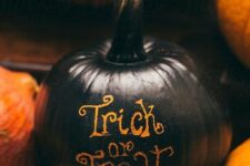 12 a classy Trick ot Treat pumpkin with letters left non-painted is a cool and easy to realize decoration for Halloween