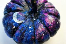 13 a small black, blue and hot pink pumpkin with white spot stars, large stars and moons for Halloween decor