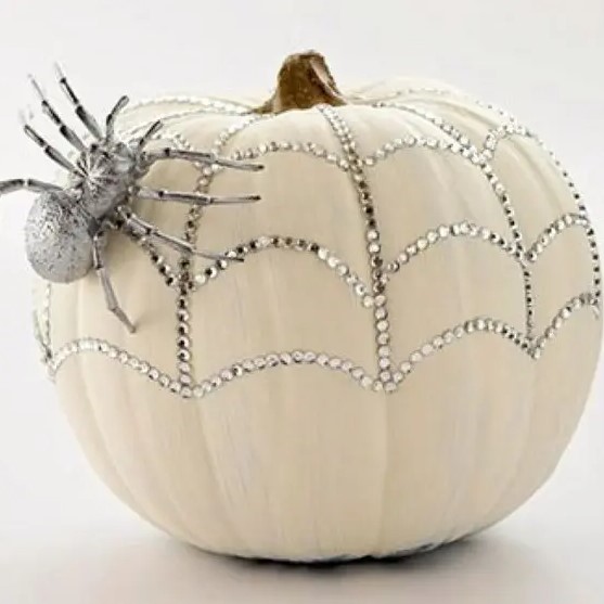 a sparkling pumpkin with rhinestones and a silver spider for a glam feel is a pretty solution for Halloween
