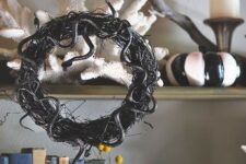 13 a vine and black snake Halloween wreath is a timeless and cool decoration for this spooky holiday