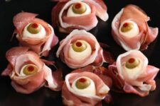 14 scary Halloween appetizers of bacon, olives, cheese are adorable for an adult party, and they look spooky