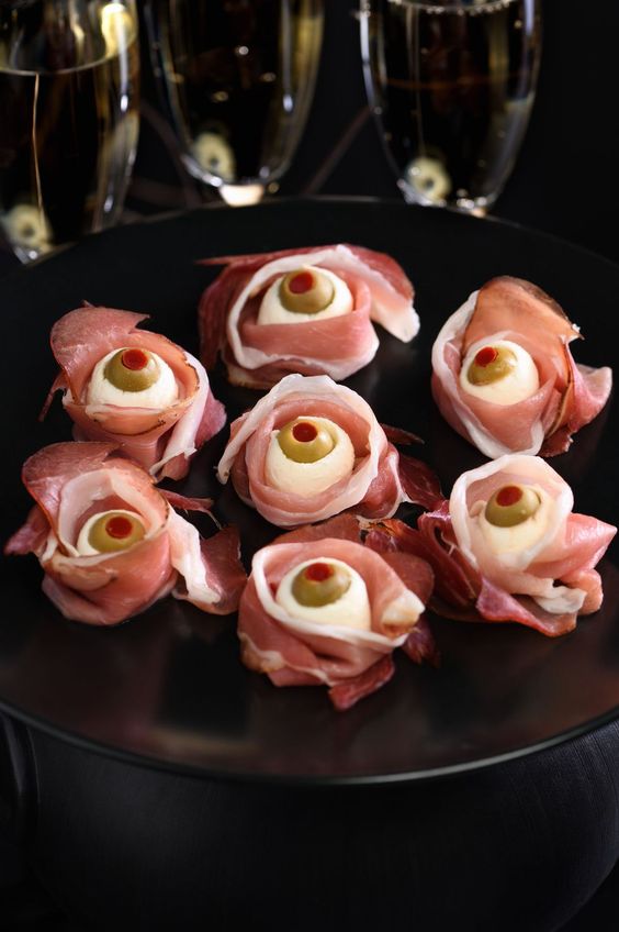 scary Halloween appetizers of bacon, olives, cheese are adorable for an adult party, and they look spooky