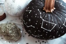 15 a matte black pumpkin with white constellations and stars drawn with a simple white sharpie is a gorgeous idea for Halloween
