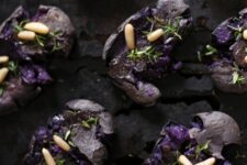 15 smashed purple potatoes with pine nuts and thyme look scary enough and moody and are great for Halloween