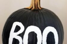 22 a simple black pumpkin with BOO letters is a cool and fast to realize idea for Halloween