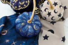 23 very pretty small pumpkins in blue, navy and white, with stars, moons and tiny sparkles are great for celestial Halloween parties