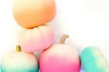 25 an arrangement of bold ombre pumpkins for Halloween and just for fall will give a touch of bright color and create a mood in the space
