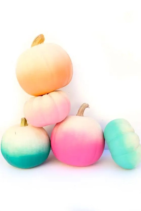 an arrangement of bold ombre pumpkins for Halloween and just for fall will give a touch of bright color and create a mood in the space