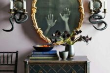 27 creative mirror decor showing off some ghost hands inside it is a cool and bold idea, all you need to do is to print out