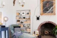 28 simple and stylish Halloween decor with a portrait covered with spiderweb, black and white pumpkins and a giant spider is cool
