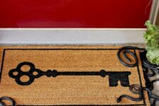 29 a door mat with small snakes underneath is a cool idea for Halloween porches