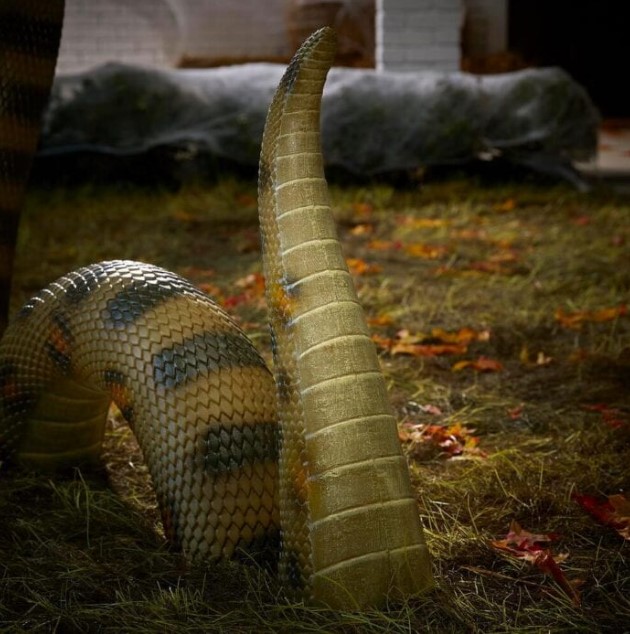 a giant anaconda is a stylish and really scary decoration for Halloween that you can install in your outdoor space