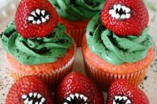 30 bright and spooky Halloween cupcakes with green toppings, red strawberries with teeth are great for Halloween