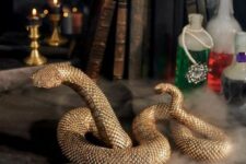 32 a gold resin snake with a textured metallic gold finish is a lovely idea for Halloween decor and it looks refined