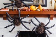 33 such oversized spiders covering a mantel and a fireplace or some wall in your home will instantly give it a Halloween feel