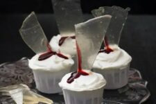 34 elegant white cupcakes topped with bloody glass shards are classy for any Halloween party, whether it’s a Dexter one or not