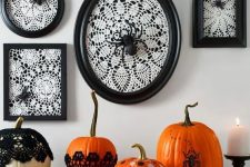 34 vintage Halloween console styling, with white doilies in black frames, spiders, bold pumpkins with polka dots and in doilies plus a candle