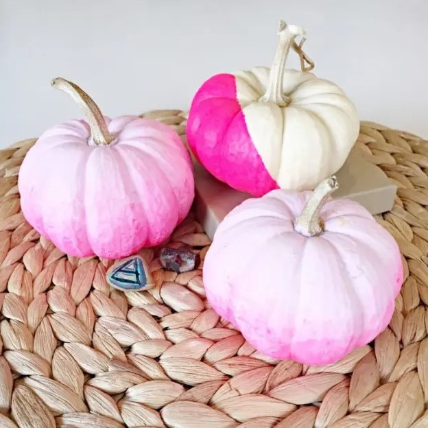 DIY ombre and color block pumpkins in the shades of pink are a great idea for a pink Halloween space