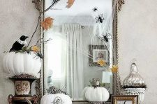 a vintage halloween arrangement with a oversized mirror
