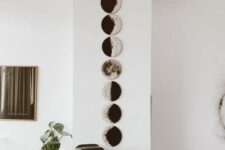 36 a wall art with moon phases is very lovely and looks modern and bold, perfect for a boho space