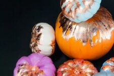 37 give your Halloween decor a big dose of glam with these no-carve copper foil pumpkins