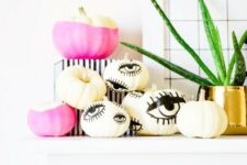 39 hot pink color block and eye pumpkins can be made with paint and a sharpie easily for a modern Halloween party