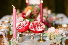 39 make easy centerpieces just cutting pomegranates in halves and placing them on stands