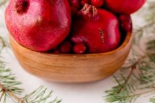 40 put pomegranates and cranberries in a wooden bowl for a centerpiece, it’s perfect for Christmas, and will do for the fall, too