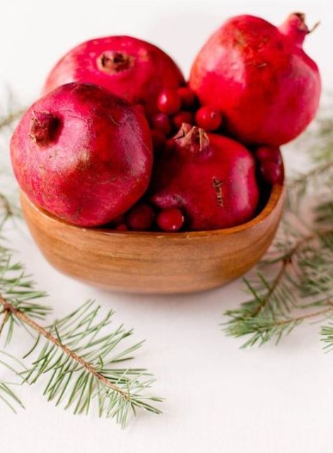 put pomegranates and cranberries in a wooden bowl for a centerpiece, it's perfect for Christmas, and will do for the fall, too