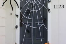 a lovely halloween decor idea of a front porch