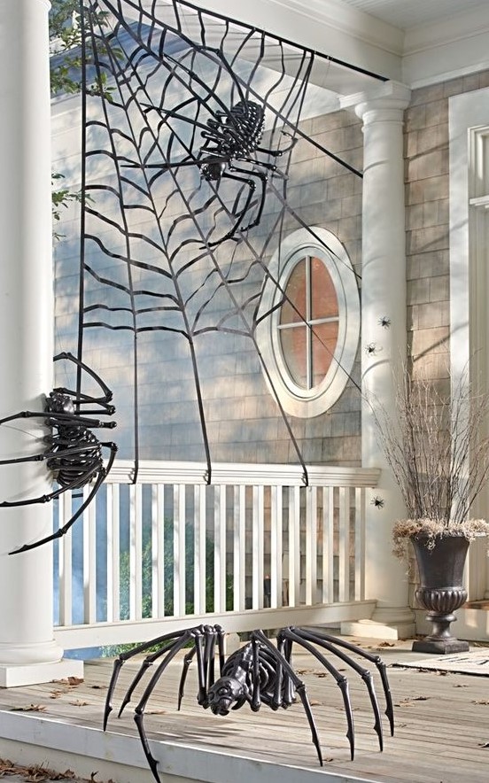 a spiderweb with skeleton spiders is a nice scene for your Halloween front porch