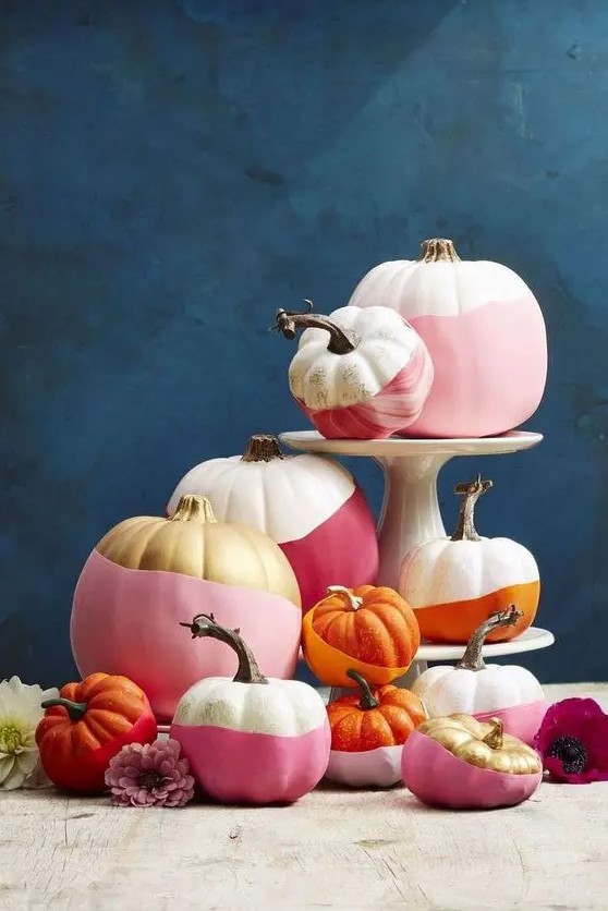 modern color block Halloween pumpkins in white, pink, burgundy, gold and orange is a great idea for bold Halloween decor