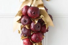 a lovely pomegranate wreath for a front door