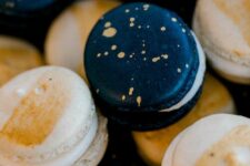 44 blue and gold splatter and white with gold touches macarons will be nice favors or desserts at a celestial Halloween party