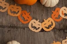 47 a simple and fun orange and light yellow jack-o-lantern Halloween garland of paper is a cool idea to style a space