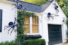 47 giant black spiders with a touch of fluff and spiderweb are great for styling your home outdoors, attach them to the walls and ground