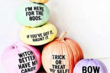 48 an arrangement of Halloween pumpkins with fun and quirky phrases on them for a modern touch