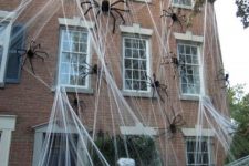 48 giant spiders in spiderwebs will make your house look very spooky from outdoors and not everyone will risk to visit it