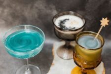 48 lovely Halloween celestial cocktails in turquoise color, with a moon and star-shaped stirrers